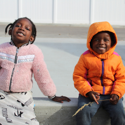 Image of two children who are excited about their new playground