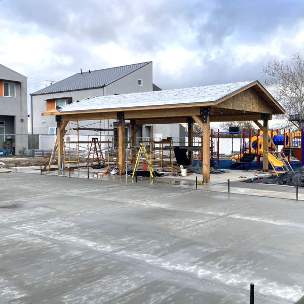 image of a cement pad with a picnic pavilion in the background